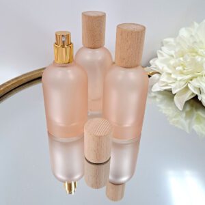 Glazen flesje 50 ml met gouden spraydop en houten dop - frosted pink