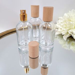 Glazen flesje 50 ml met gouden spraydop en houten dop - transparant